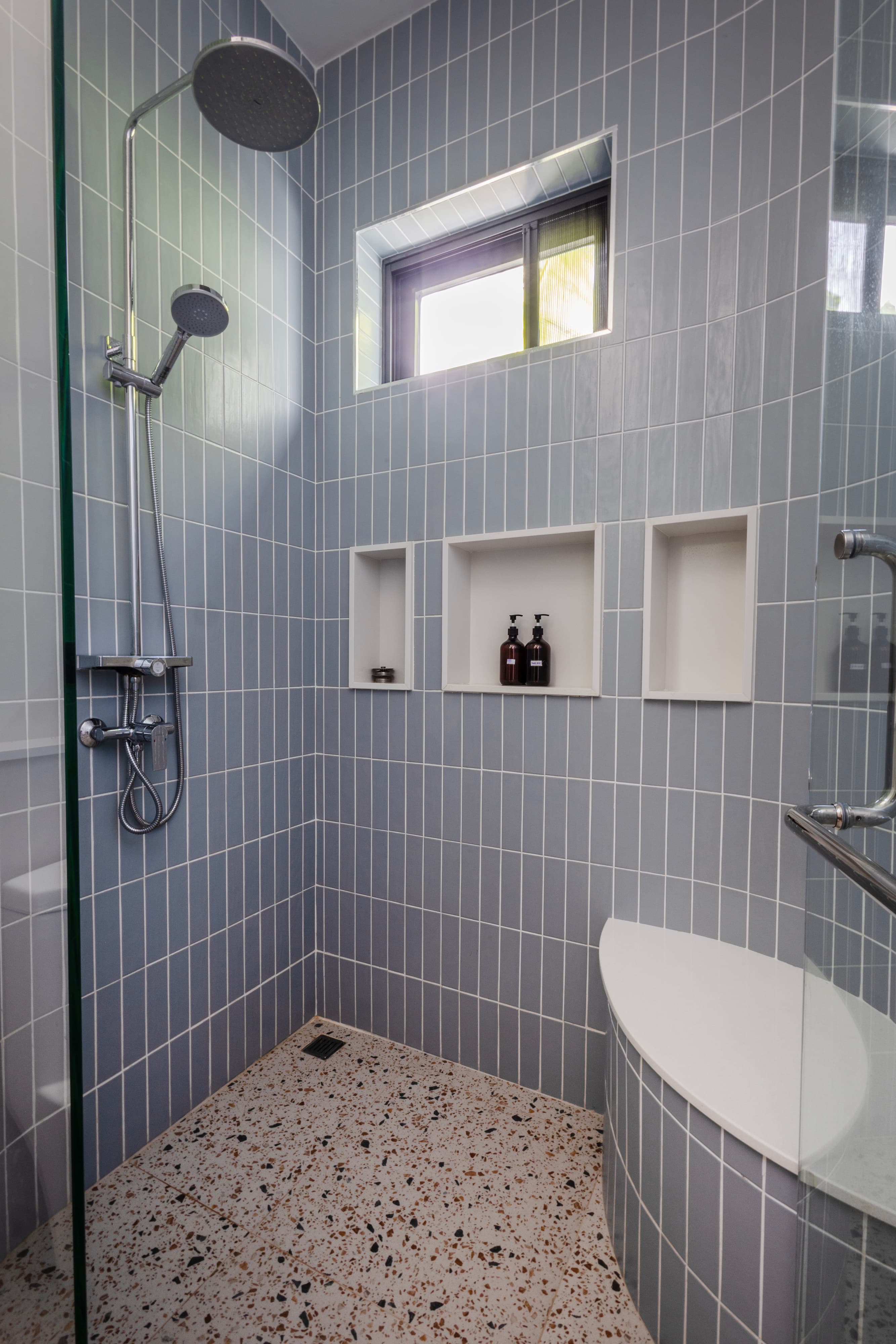 Walk-in rainfall shower with terrazzo floor — Barefoot Villas