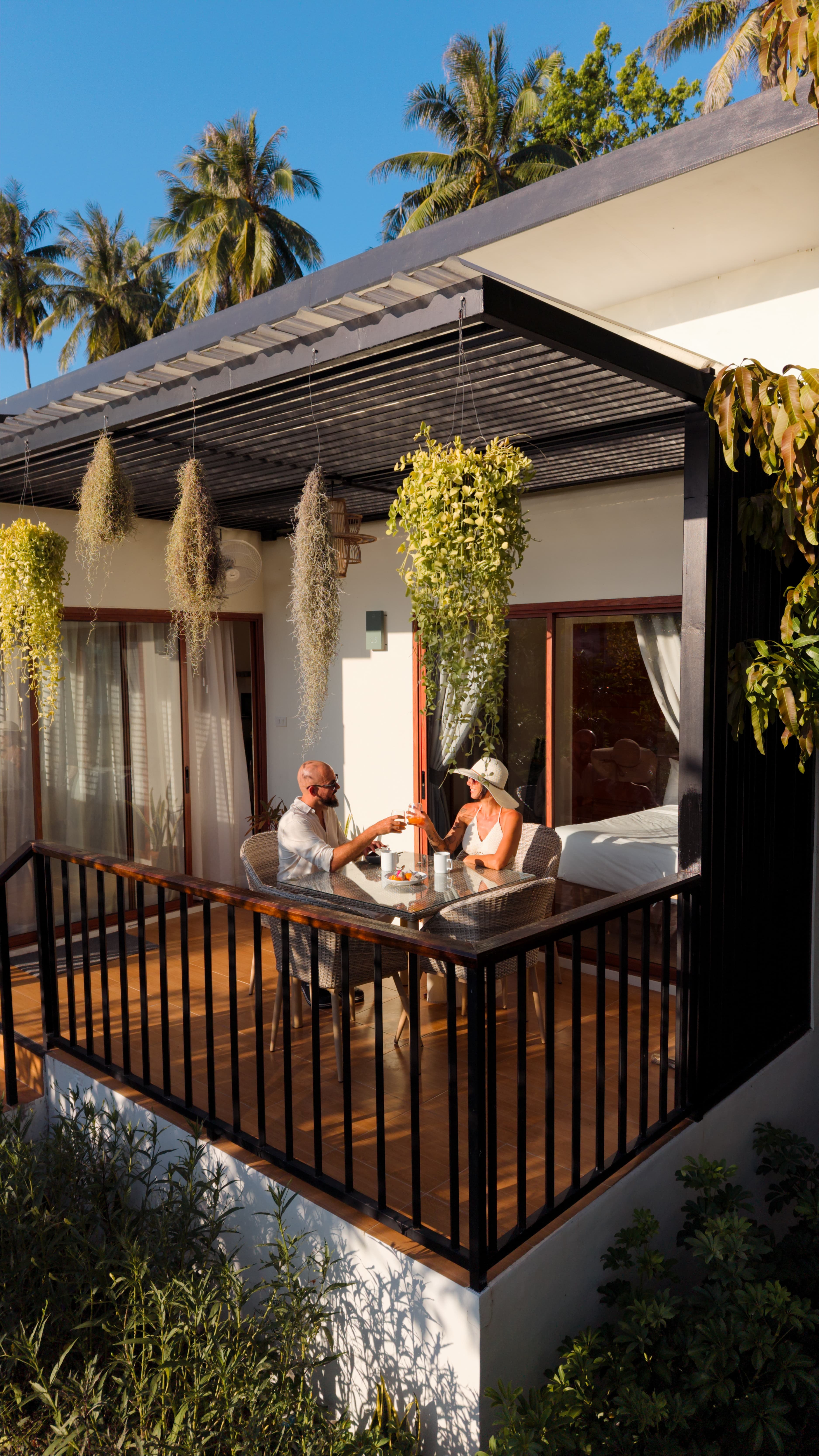 Couple at breakfast on the terrace, golden hour — Caya Beach by Satori