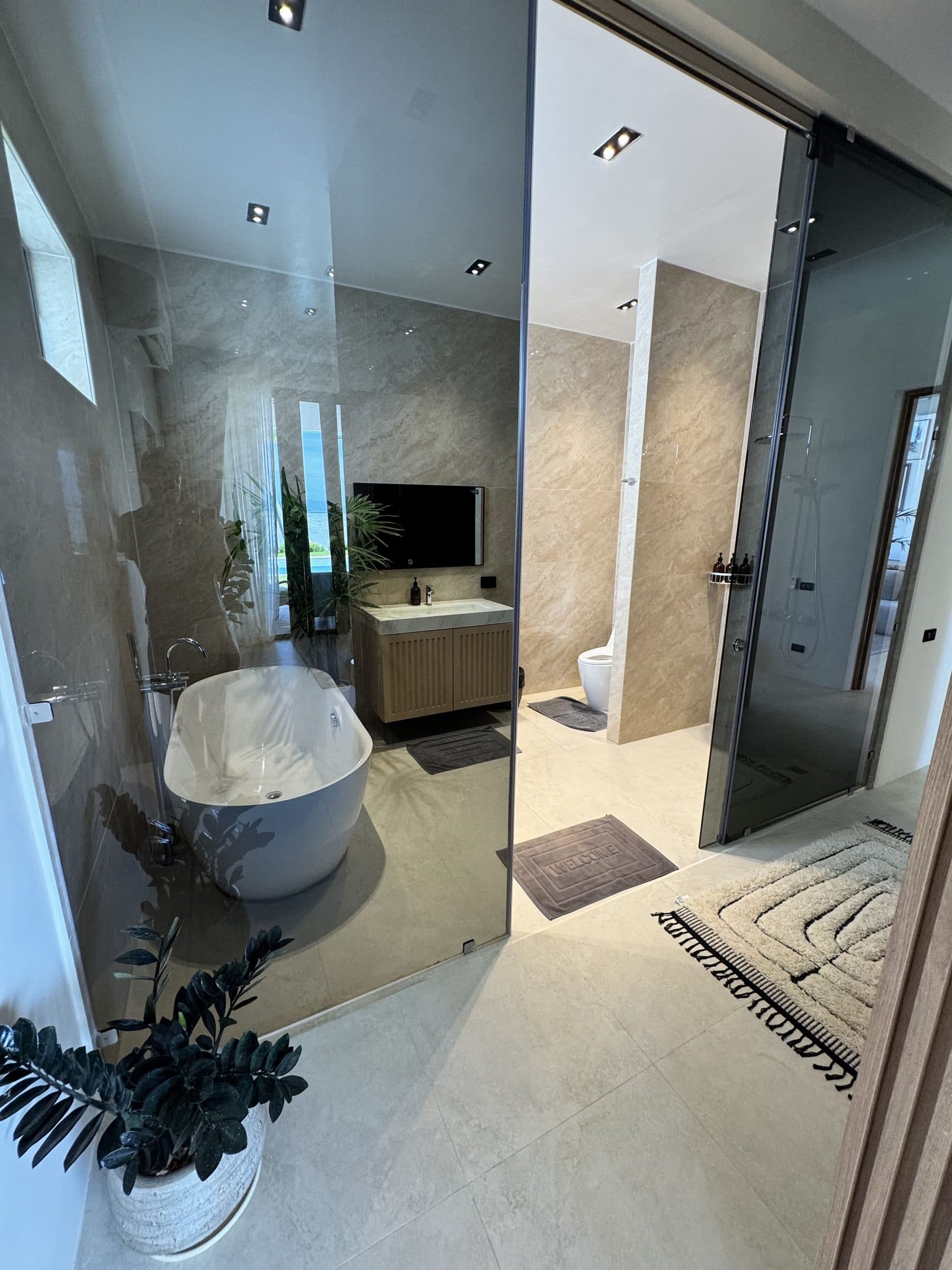 Master bathroom with freestanding bathtub and walk-in shower